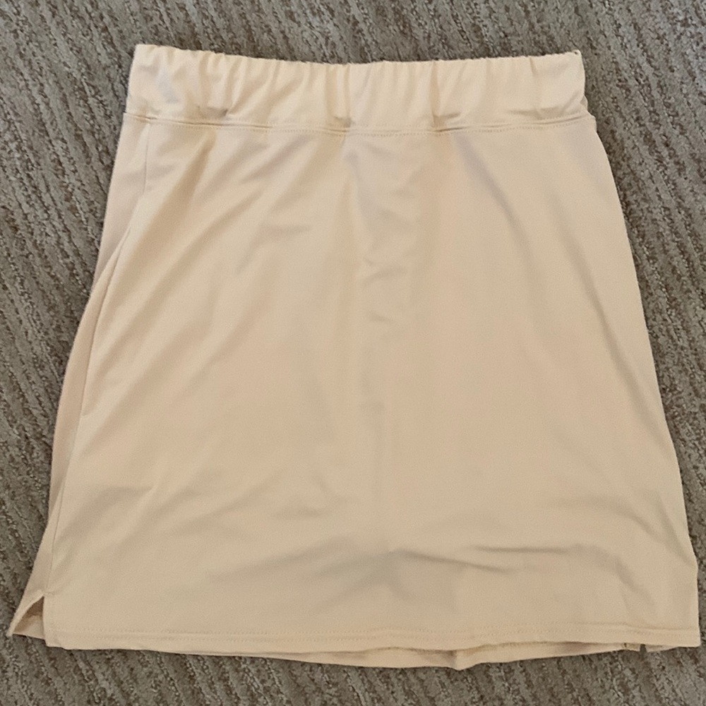 Golden Skorts. Slits on sides. Size Medium. 100% Polyester. Made in China.